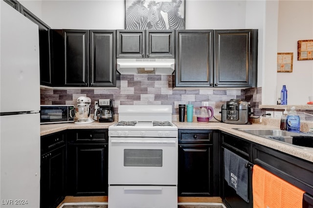 kitchen with backsplash and white appliances