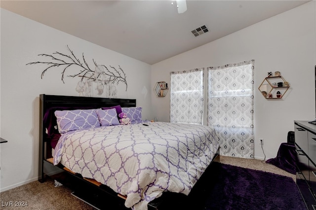 carpeted bedroom featuring vaulted ceiling and ceiling fan