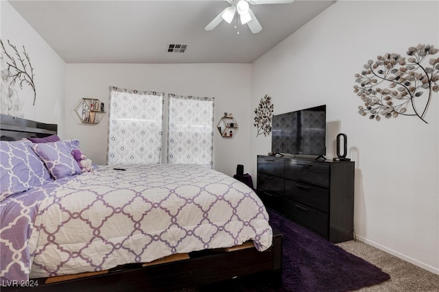 bedroom with lofted ceiling, carpet flooring, and ceiling fan