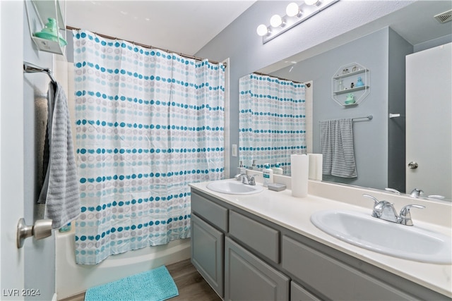 bathroom with vanity, shower / tub combo with curtain, and wood-type flooring