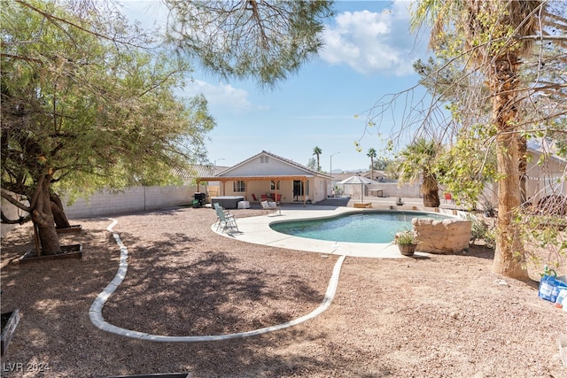 view of swimming pool with a patio area