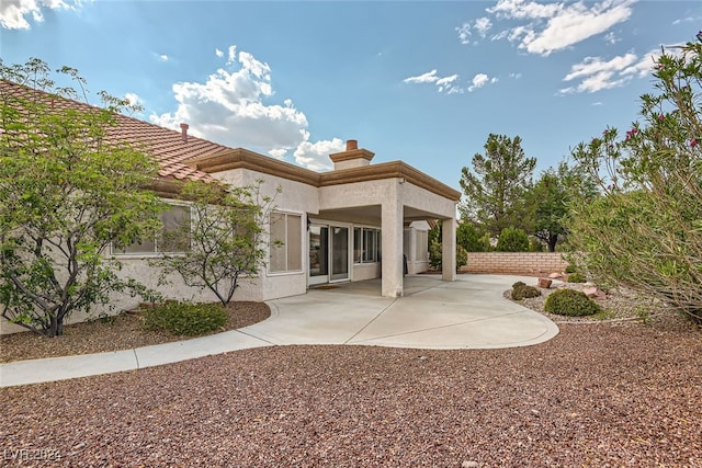 back of house featuring a patio area