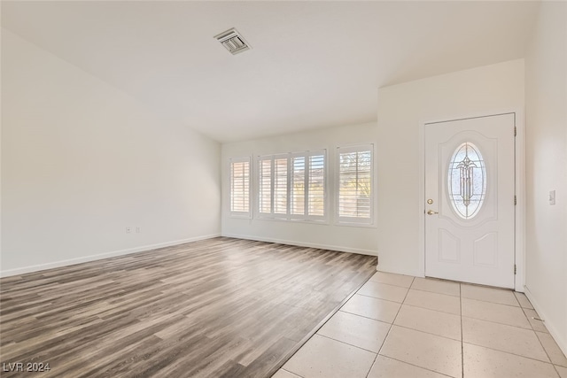 entryway with light hardwood / wood-style floors