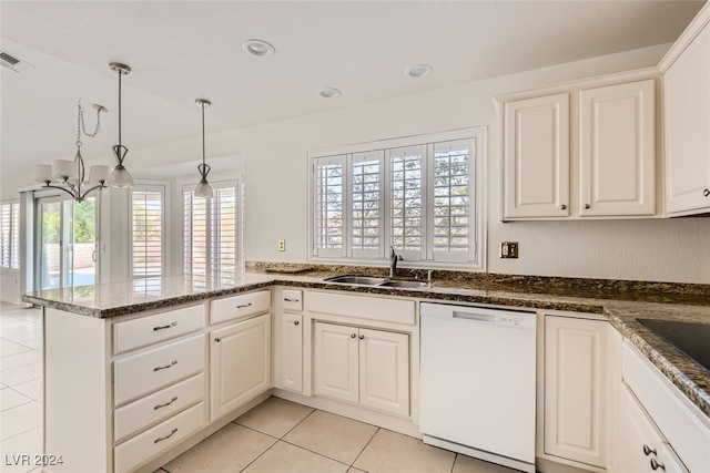 kitchen featuring white dishwasher, sink, pendant lighting, light tile patterned floors, and white cabinets