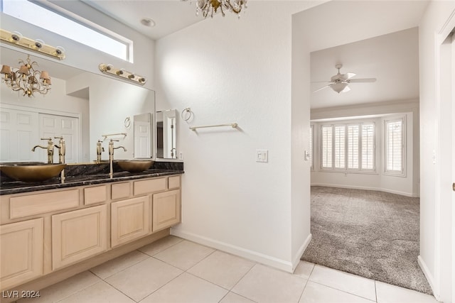 bathroom featuring vanity, tile patterned floors, and ceiling fan with notable chandelier