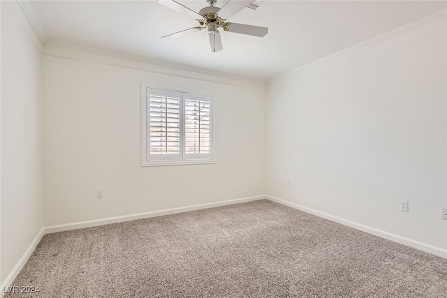 carpeted spare room featuring ceiling fan and ornamental molding