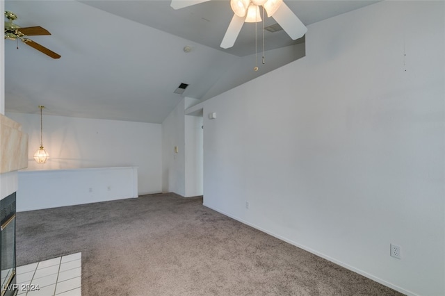 carpeted spare room with lofted ceiling and ceiling fan