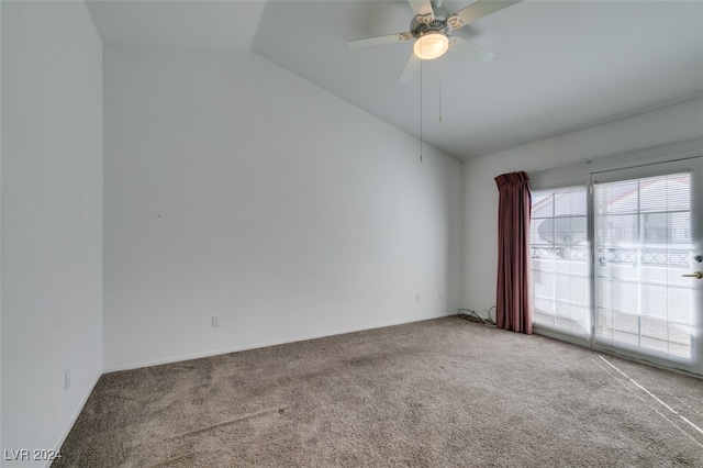 empty room with lofted ceiling, light colored carpet, and ceiling fan