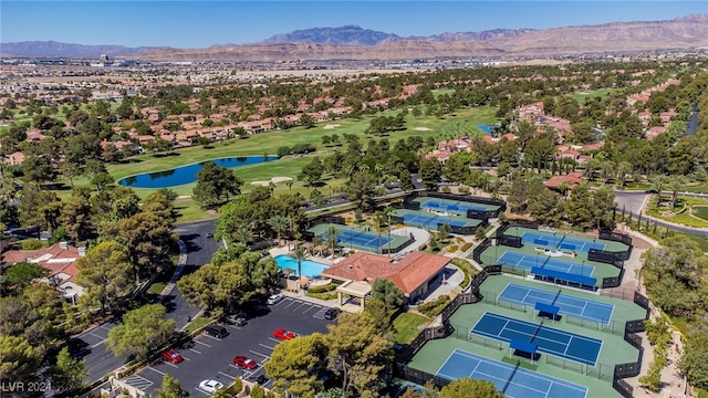 birds eye view of property with a water and mountain view