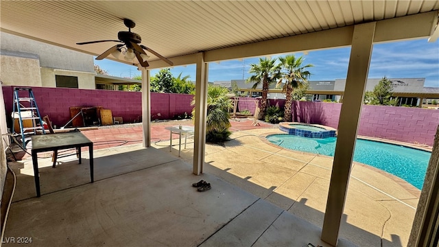 view of pool with a patio area, an in ground hot tub, and ceiling fan