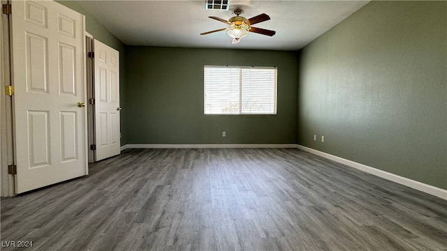 unfurnished bedroom featuring wood-type flooring and ceiling fan