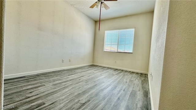 empty room with light hardwood / wood-style floors and ceiling fan