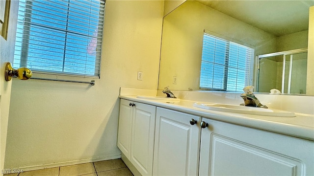 bathroom with vanity, an enclosed shower, and tile patterned flooring