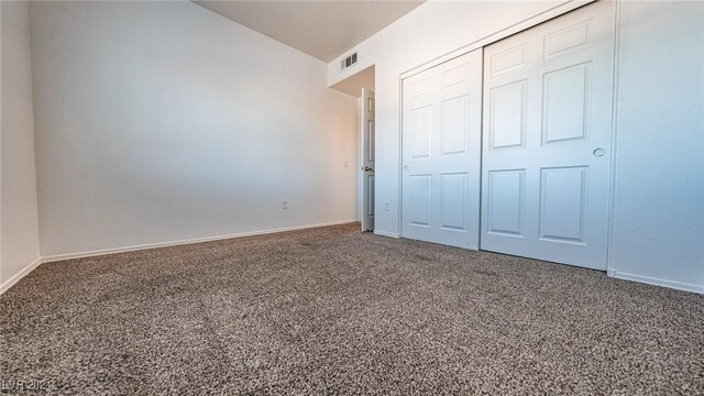 1050 E Cactus Ave Unit 2106, Las Vegas, NV 89183 - unfurnished bedroom with carpet flooring, a closet, and baseboards