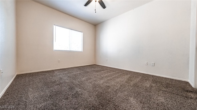 carpeted empty room with ceiling fan and vaulted ceiling