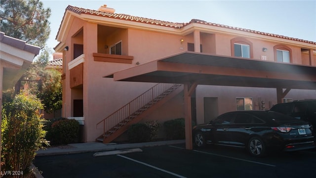 1050 E Cactus Ave Unit 2106, Las Vegas, NV 89183 - view of property with stairway and covered parking