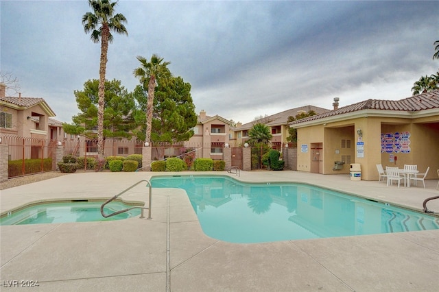 view of swimming pool with a patio area