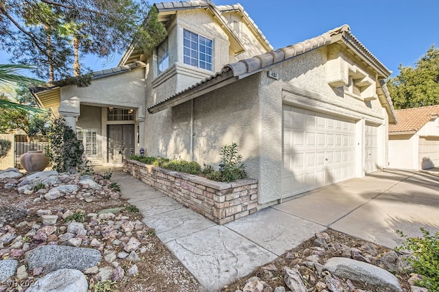 view of side of property featuring a garage