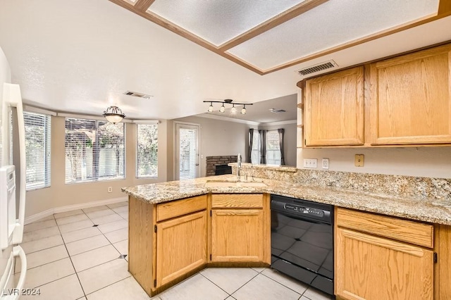 kitchen featuring kitchen peninsula, sink, plenty of natural light, and black dishwasher