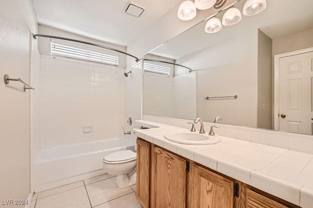 full bathroom with tile patterned flooring, vanity, toilet, and tiled shower / bath combo