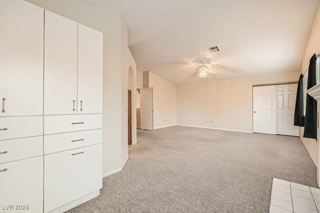 unfurnished living room featuring light colored carpet