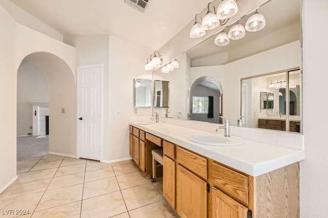 bathroom with tile patterned flooring and vanity