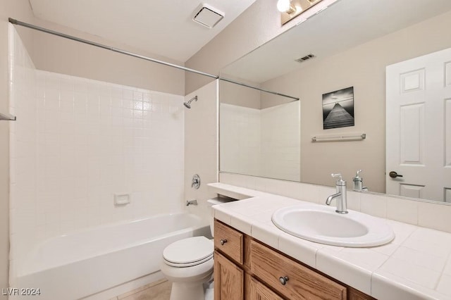 full bathroom featuring tile patterned flooring, vanity, toilet, and shower / tub combination