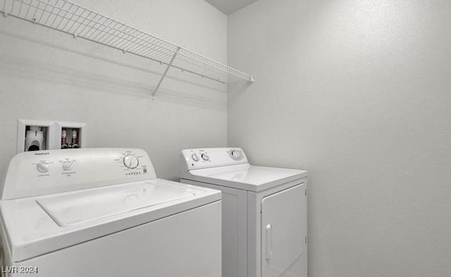 washroom with separate washer and dryer