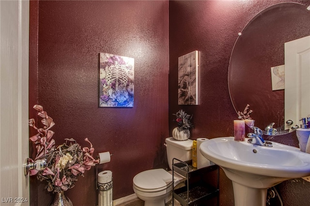 bathroom with toilet and sink