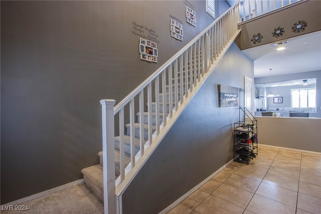 staircase with tile patterned flooring