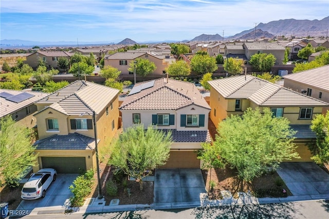 birds eye view of property with a mountain view