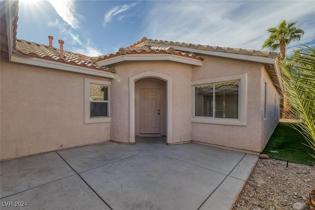 doorway to property with a patio