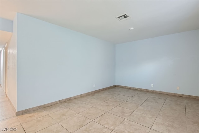 unfurnished room with light tile patterned floors