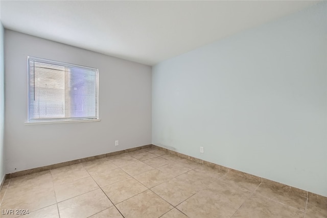 empty room featuring light tile patterned floors