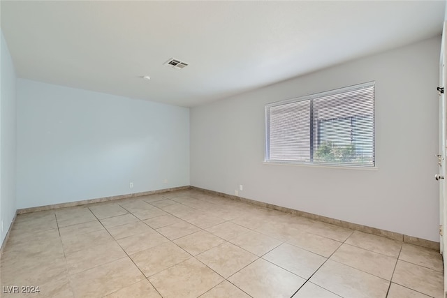 spare room with light tile patterned flooring