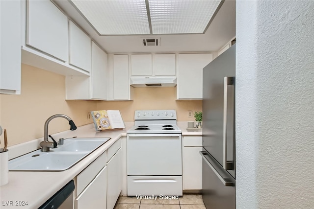 kitchen with stainless steel appliances, white cabinetry, sink, and light tile patterned floors