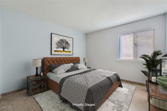 bedroom with light tile patterned floors