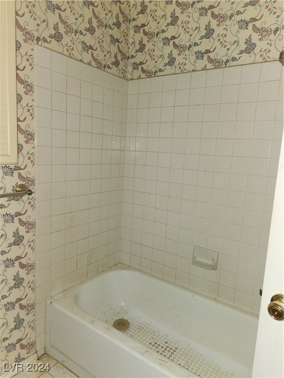 bathroom featuring shower with separate bathtub