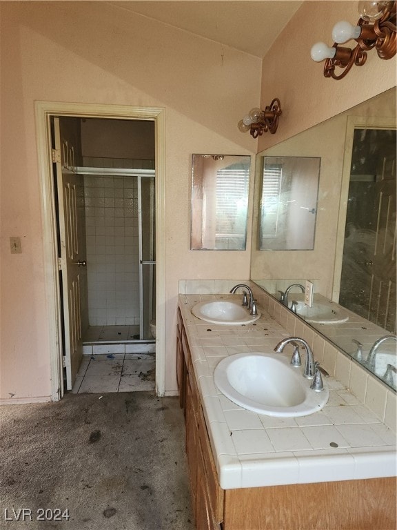 bathroom with vanity, a shower with shower door, toilet, and lofted ceiling