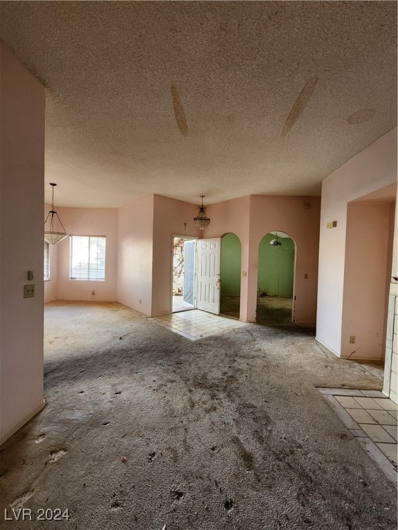 interior space with a textured ceiling