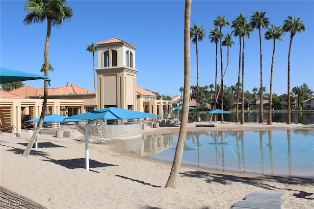 view of swimming pool with a water view