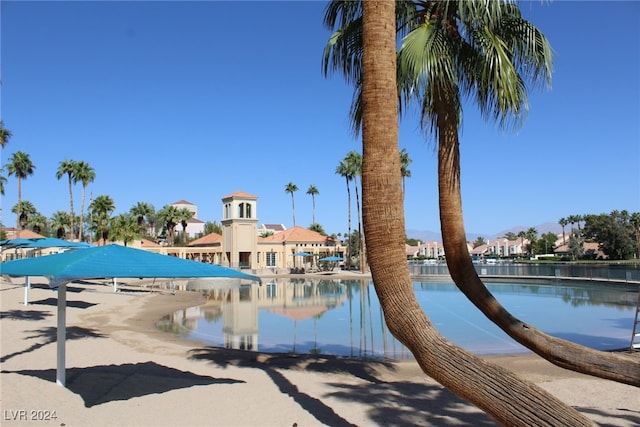 view of pool with a water view