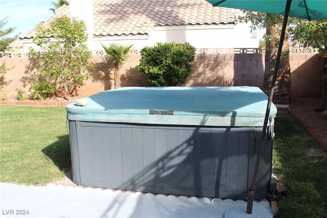 exterior space featuring a hot tub