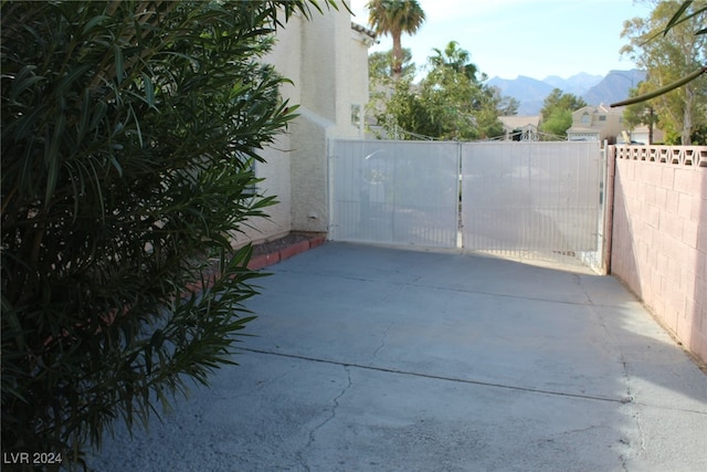 view of gate featuring a mountain view