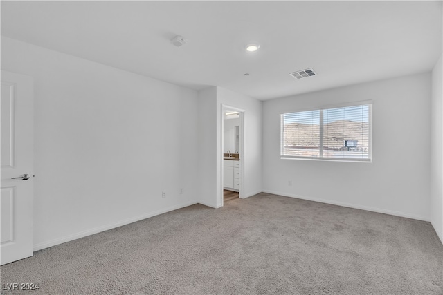 unfurnished bedroom with light carpet