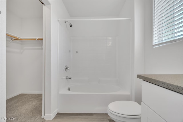 full bathroom featuring vanity, toilet, wood-type flooring, and shower / bathtub combination