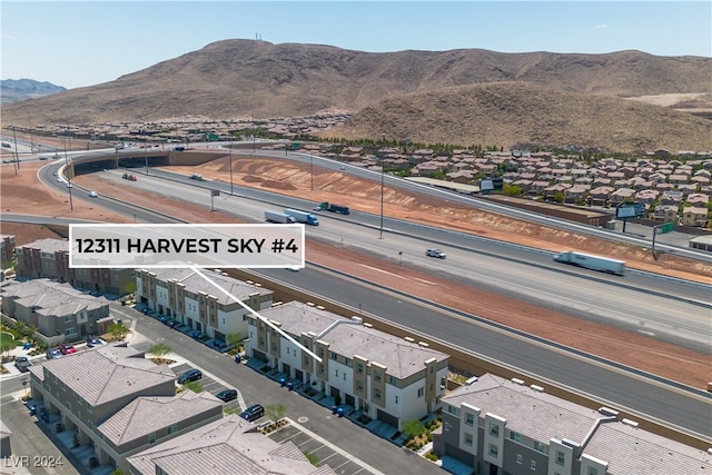 birds eye view of property featuring a mountain view