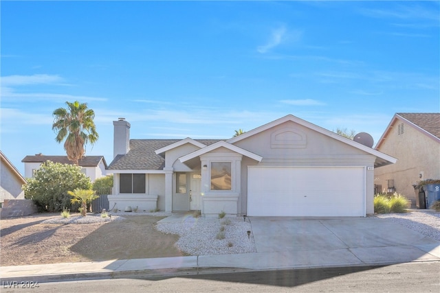 ranch-style home featuring a garage