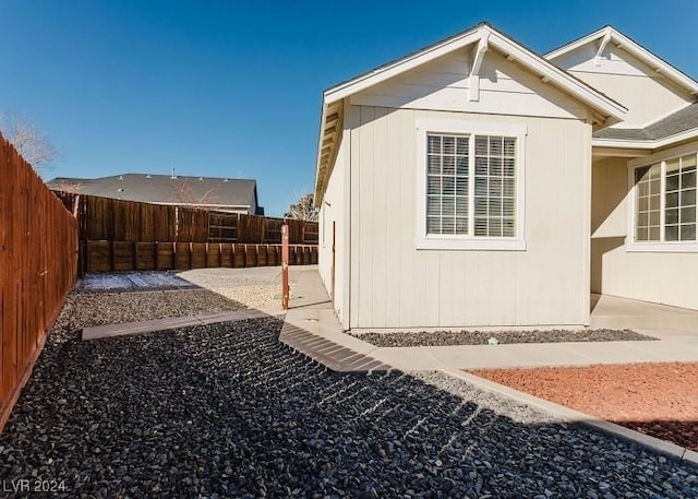 view of side of home featuring a patio