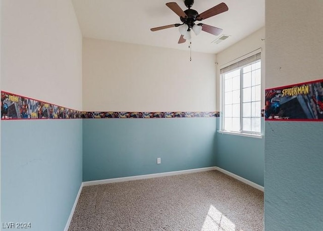 carpeted empty room featuring ceiling fan